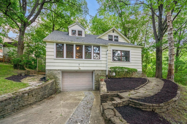 6 Hanover Pl, Fort Thomas, KY 41075 - view of front of home featuring driveway, an attached garage, a shingled roof, and stone siding