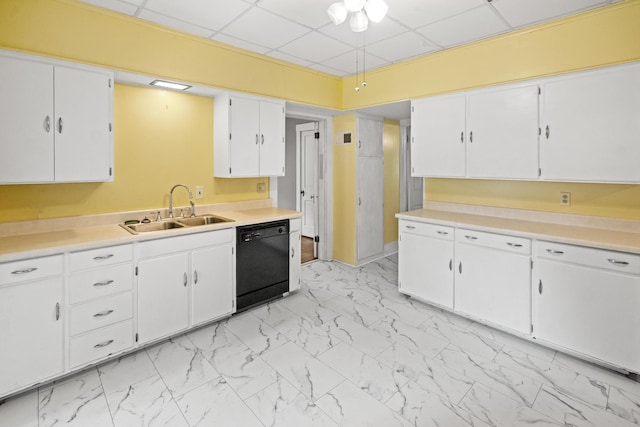 6 Hanover Pl, Fort Thomas, KY 41075 - kitchen with black dishwasher, a drop ceiling, light marble finish floors, white cabinets, and light countertops