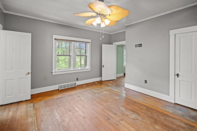 6 Hanover Pl, Fort Thomas, KY 41075 - unfurnished bedroom with hardwood / wood-style flooring, ornamental molding, and a ceiling fan