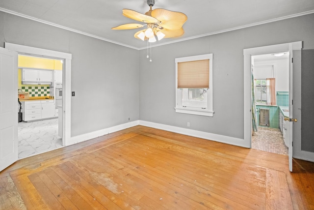 6 Hanover Pl, Fort Thomas, KY 41075 - spare room featuring crown molding, hardwood / wood-style floors, and a ceiling fan