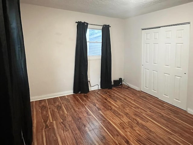 635 Willow St, Elsmere, KY 41018 - unfurnished bedroom with wood finished floors, a textured ceiling, and a closet