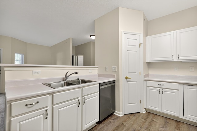 523 Ivy Ridge Dr, Cold Spring, KY 41076 - kitchen with stainless steel dishwasher, white cabinetry, light wood-style floors, and light countertops