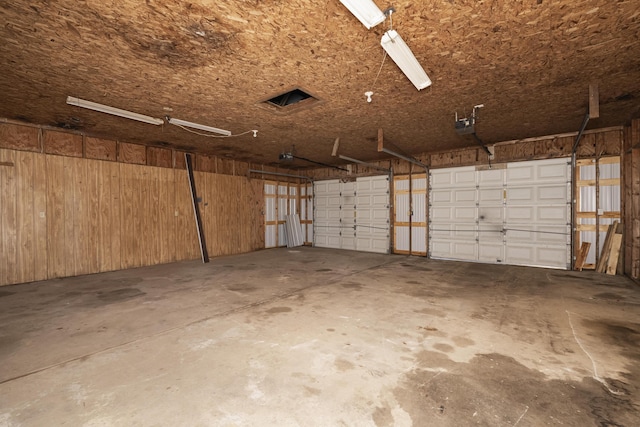 6515 Cull Rd, Owenton, KY 40359 - garage featuring a garage door opener and wooden walls