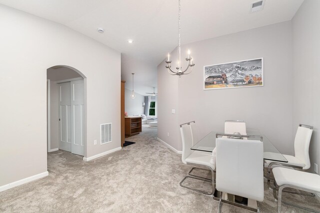 2517 Bella Rdg, Covington, KY 41017 - dining space with arched walkways, a chandelier, carpet, a ceiling fan, and lofted ceiling