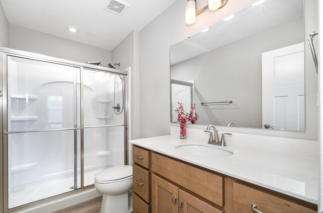 2517 Bella Rdg, Covington, KY 41017 - bathroom with vanity, a stall shower, and wood finished floors