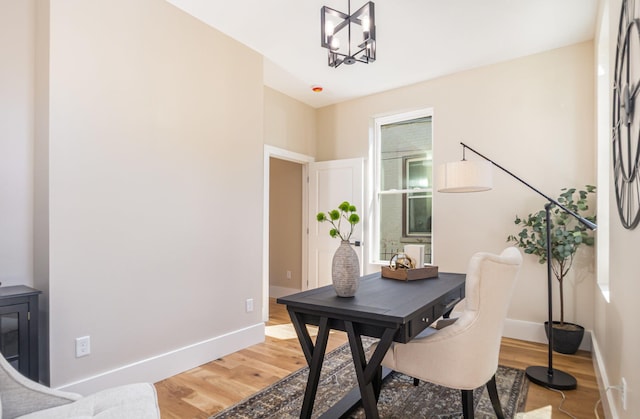 243 Latta Ave, Ludlow, KY 41016 - dining room with light wood-style floors, a chandelier, and an office area