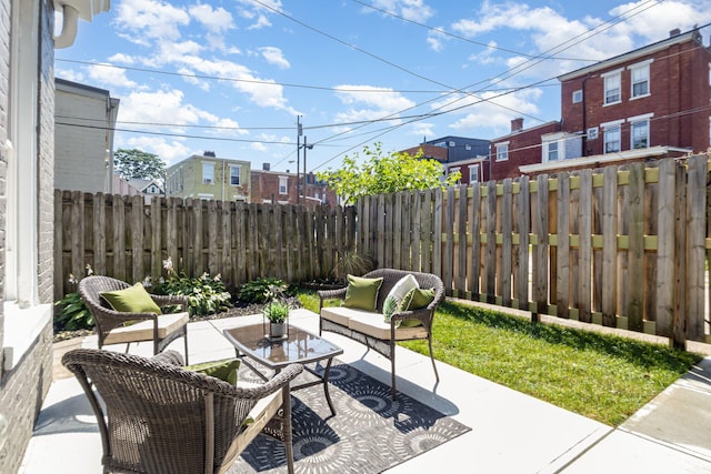 243 Latta Ave, Ludlow, KY 41016 - fenced backyard with outdoor lounge area, a patio, and a residential view