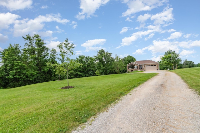 15344 Carlisle Rd, Crittenden, KY 41030 - view of front of property featuring dirt driveway, an attached garage, and a front lawn