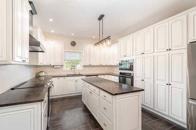15344 Carlisle Rd, Crittenden, KY 41030 - kitchen featuring stove, dark countertops, black oven, stainless steel refrigerator, and a kitchen island