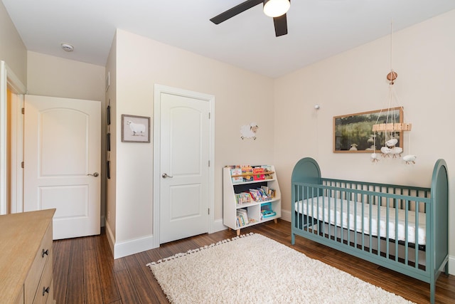 15344 Carlisle Rd, Crittenden, KY 41030 - bedroom featuring wood finished floors, a crib, and ceiling fan
