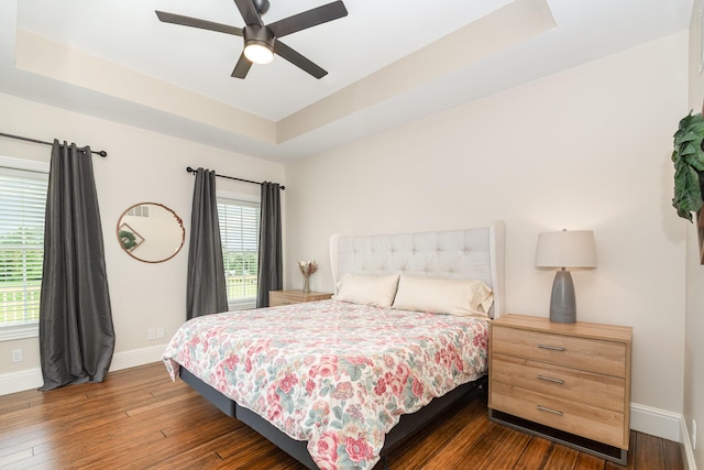 15344 Carlisle Rd, Crittenden, KY 41030 - bedroom featuring dark wood-style flooring, a raised ceiling, and a ceiling fan