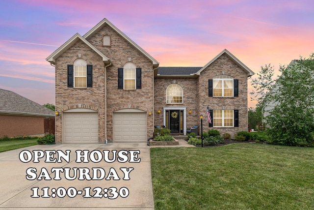 1761 Waverly Dr, Florence, KY 41042 - traditional-style house featuring a front lawn, an attached garage, brick siding, and driveway