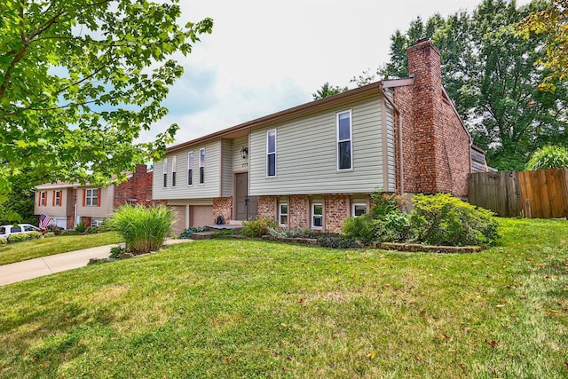 2709 Wesley Dr, Villa Hills, KY 41017 - raised ranch featuring an attached garage, a chimney, brick siding, and concrete driveway