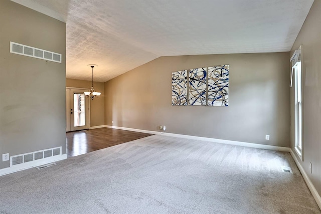 2709 Wesley Dr, Villa Hills, KY 41017 - spare room featuring carpet flooring, a chandelier, and lofted ceiling
