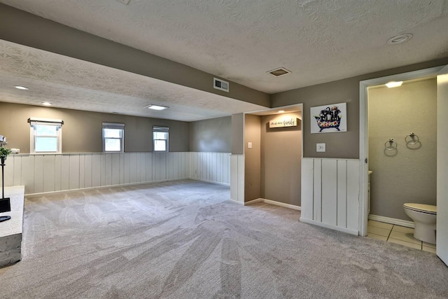 2709 Wesley Dr, Villa Hills, KY 41017 - carpeted spare room with a textured ceiling and a wainscoted wall