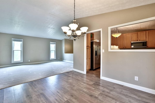 2709 Wesley Dr, Villa Hills, KY 41017 - unfurnished dining area with a chandelier and wood finished floors