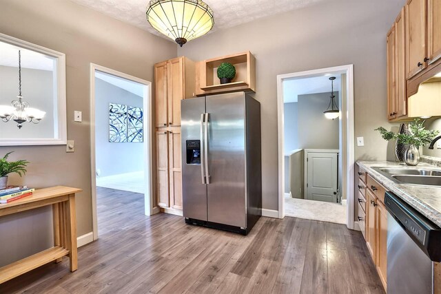 2709 Wesley Dr, Villa Hills, KY 41017 - kitchen featuring stainless steel appliances, dark wood-type flooring, light countertops, a chandelier, and light brown cabinetry
