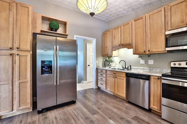 2709 Wesley Dr, Villa Hills, KY 41017 - kitchen featuring appliances with stainless steel finishes, light brown cabinetry, wood finished floors, and open shelves