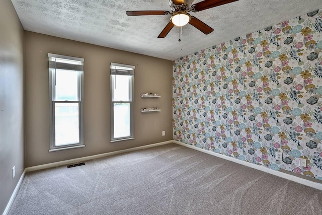 2709 Wesley Dr, Villa Hills, KY 41017 - empty room featuring a textured ceiling, carpet floors, and a ceiling fan