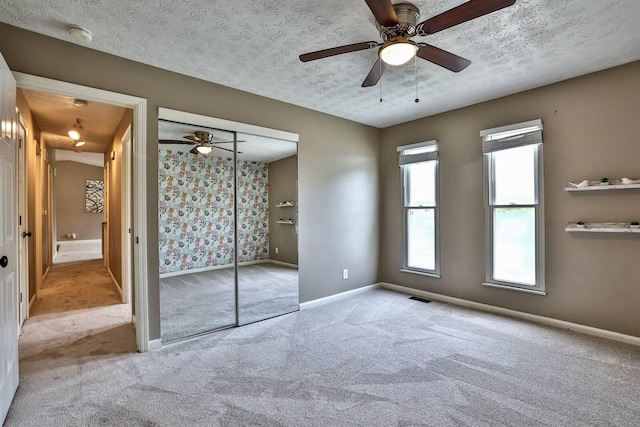 2709 Wesley Dr, Villa Hills, KY 41017 - unfurnished bedroom featuring carpet flooring, a textured ceiling, a closet, and ceiling fan