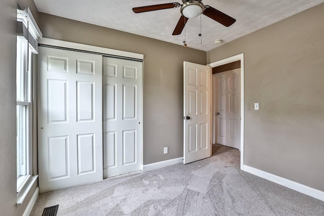 2709 Wesley Dr, Villa Hills, KY 41017 - unfurnished bedroom featuring light carpet, a closet, a textured ceiling, and ceiling fan