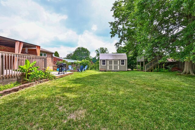 2709 Wesley Dr, Villa Hills, KY 41017 - fenced backyard with a storage unit, a deck, and stairway