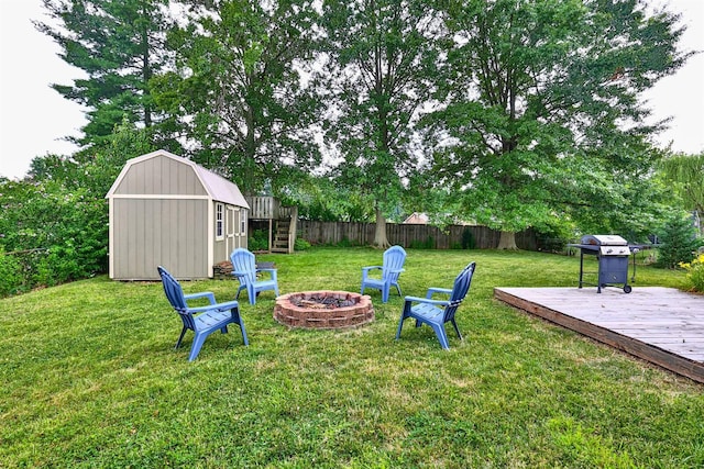 2709 Wesley Dr, Villa Hills, KY 41017 - view of yard featuring a fire pit, a storage unit, a deck, and stairs