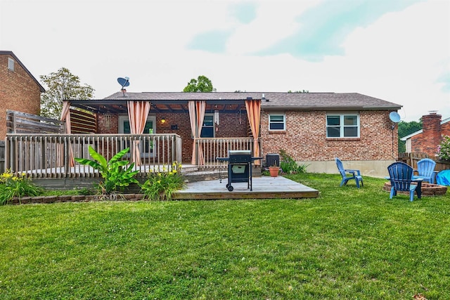 2709 Wesley Dr, Villa Hills, KY 41017 - rear view of property featuring a wooden deck, brick siding, and an outdoor fire pit