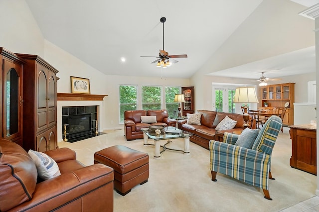 257 Ridgepointe Dr, Cold Spring, KY 41076 - living area with ceiling fan, light colored carpet, a tile fireplace, and high vaulted ceiling