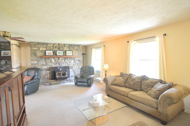 3445 Crittenden Mount Zion Rd, Dry Ridge, KY 41035 - living area featuring carpet, a textured ceiling, a wood stove, and ceiling fan