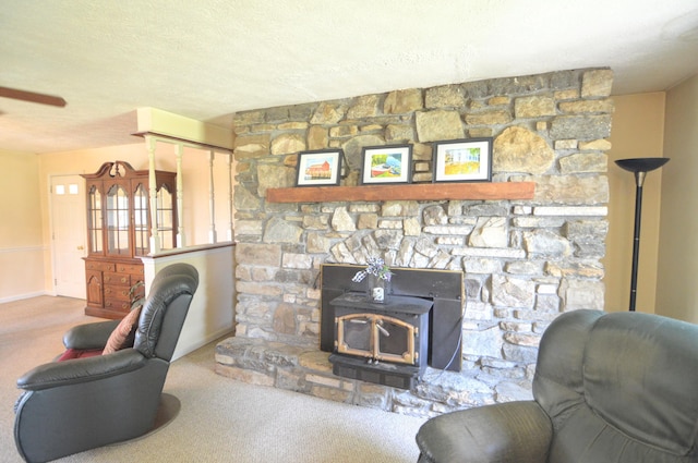 3445 Crittenden Mount Zion Rd, Dry Ridge, KY 41035 - carpeted living area featuring a wood stove, a textured ceiling, and a ceiling fan