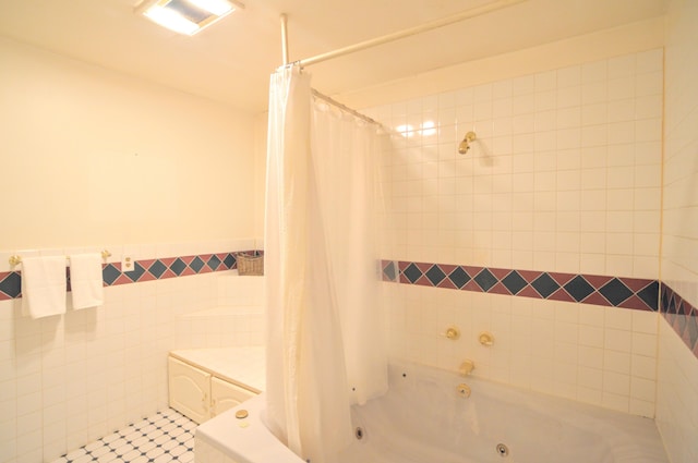 3445 Crittenden Mount Zion Rd, Dry Ridge, KY 41035 - bathroom featuring a combined bath / shower with jetted tub, tile patterned floors, wainscoting, and tile walls