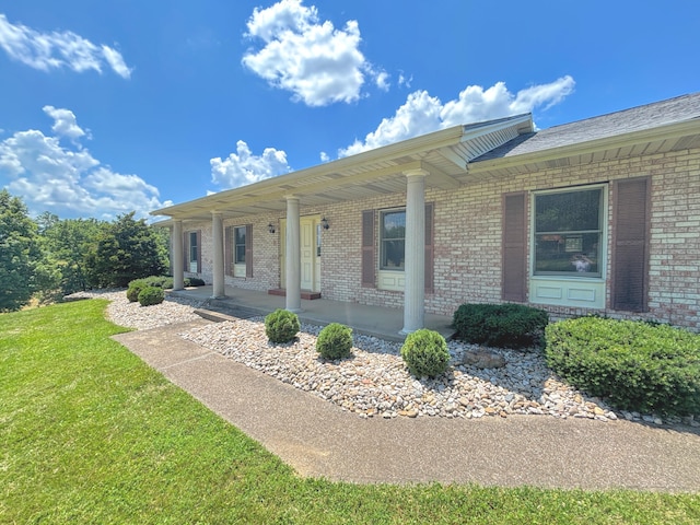 3445 Crittenden Mount Zion Rd, Dry Ridge, KY 41035 - view of front facade featuring brick siding, covered porch, and a front yard