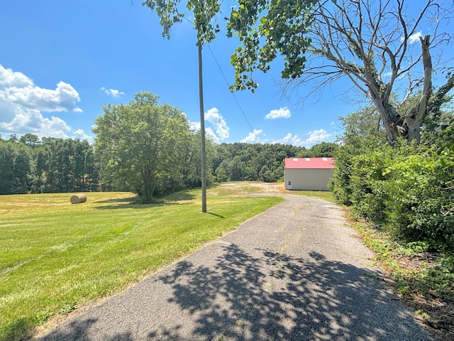 3445 Crittenden Mount Zion Rd, Dry Ridge, KY 41035 - view of front of house featuring a front yard, a wooded view, and an outdoor structure