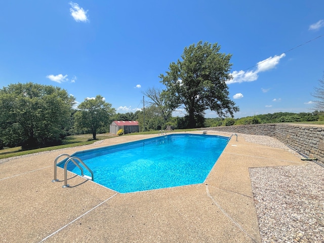 3445 Crittenden Mount Zion Rd, Dry Ridge, KY 41035 - swimming pool featuring a patio, a storage unit, and a diving board
