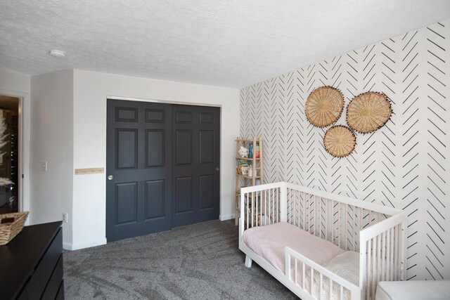 22 Carriage House Dr, Fort Thomas, KY 41075 - carpeted bedroom featuring an accent wall, a textured ceiling, and wallpapered walls