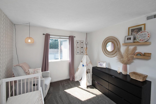 22 Carriage House Dr, Fort Thomas, KY 41075 - carpeted bedroom featuring a crib and a textured ceiling