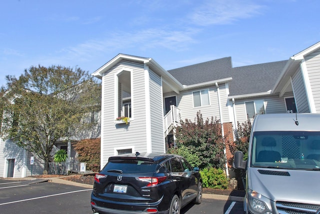 22 Carriage House Dr, Fort Thomas, KY 41075 - view of side of home featuring uncovered parking and brick siding