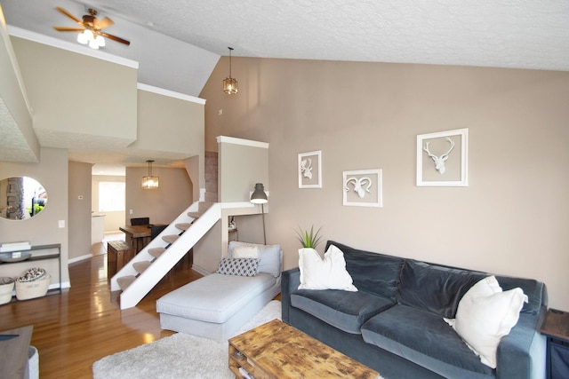 22 Carriage House Dr, Fort Thomas, KY 41075 - living area with wood finished floors, high vaulted ceiling, a textured ceiling, stairs, and ceiling fan