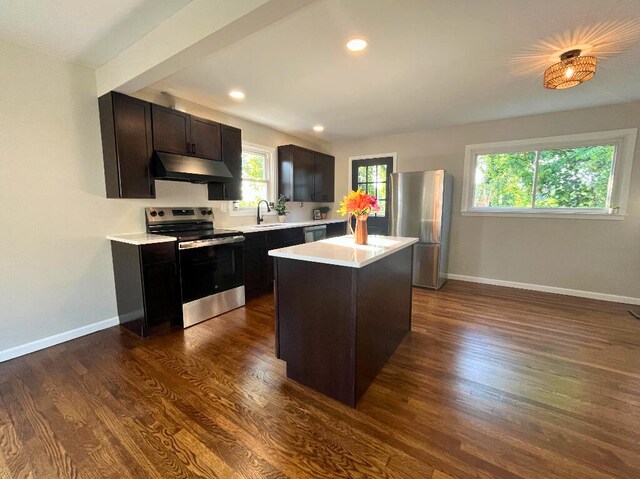 37 Fairfield Pl, Fort Thomas, KY 41075 - kitchen featuring appliances with stainless steel finishes, under cabinet range hood, light countertops, dark wood-type flooring, and recessed lighting