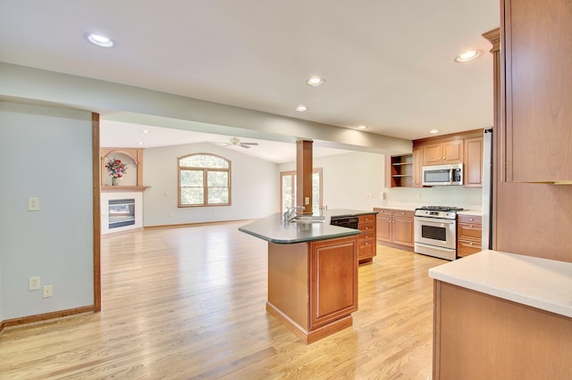 140 Williamsburg Dr, Fort Mitchell, KY 41017 - kitchen featuring stainless steel appliances, open shelves, light wood-style floors, open floor plan, and lofted ceiling