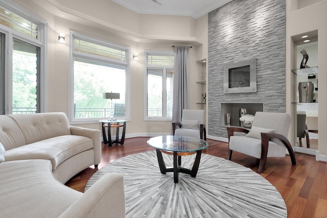 1025 Hyperion Ct, Union, KY 41091 - living room featuring wood finished floors, a stone fireplace, and crown molding