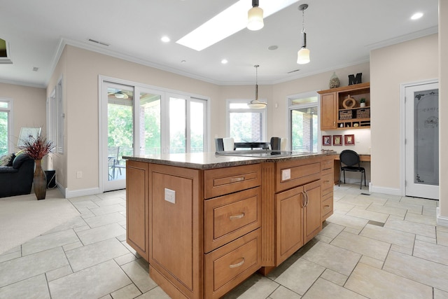 1025 Hyperion Ct, Union, KY 41091 - kitchen featuring open shelves, a skylight, decorative light fixtures, a kitchen island, and ornamental molding