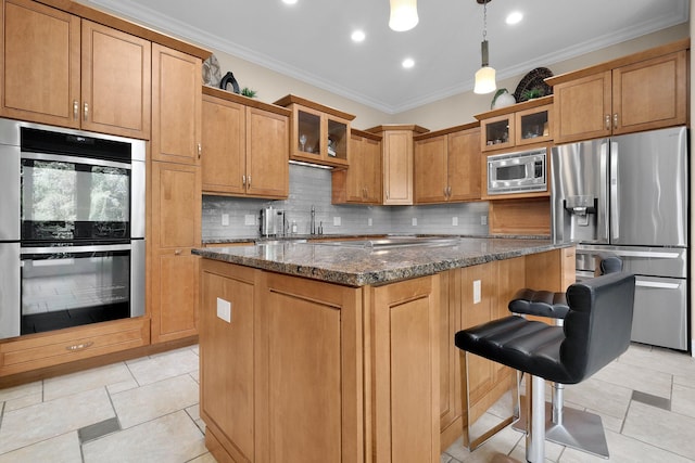 1025 Hyperion Ct, Union, KY 41091 - kitchen featuring appliances with stainless steel finishes, a center island, backsplash, ornamental molding, and glass insert cabinets