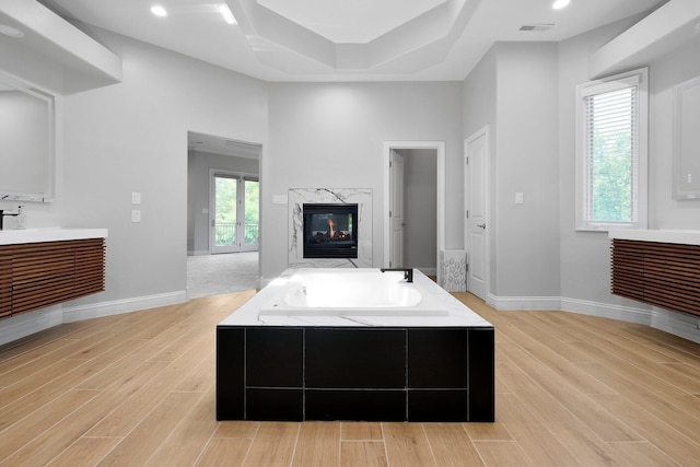 1025 Hyperion Ct, Union, KY 41091 - full bath with vanity, a bath, wood finished floors, and a high end fireplace