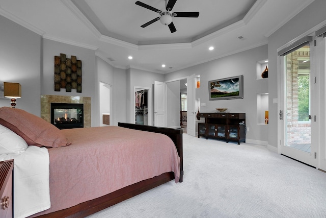 1025 Hyperion Ct, Union, KY 41091 - carpeted bedroom with a raised ceiling, access to outside, ornamental molding, recessed lighting, and a tiled fireplace