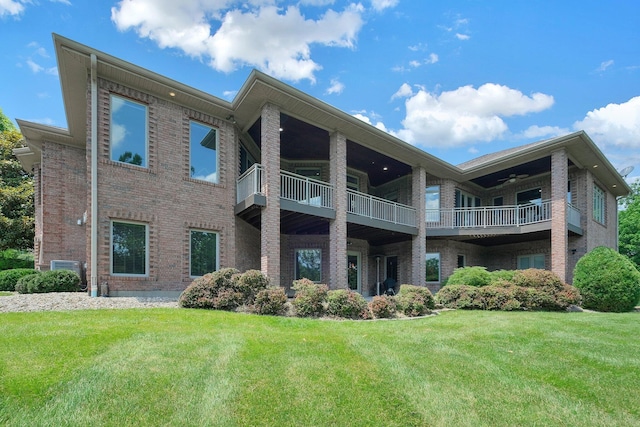 1025 Hyperion Ct, Union, KY 41091 - rear view of property with brick siding, a lawn, and a balcony