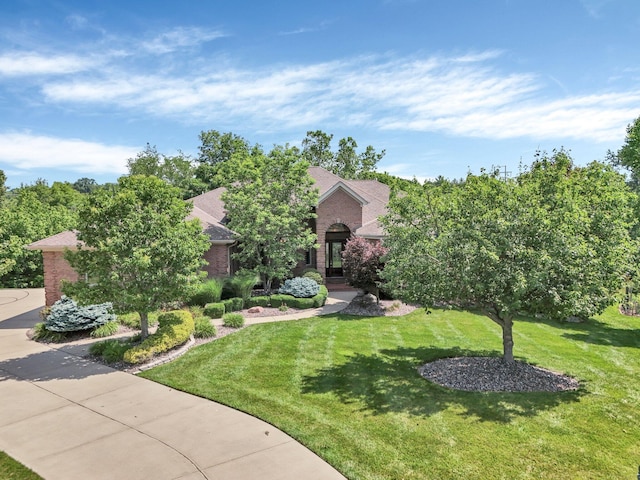 1025 Hyperion Ct, Union, KY 41091 - obstructed view of property featuring brick siding, a front lawn, and roof with shingles