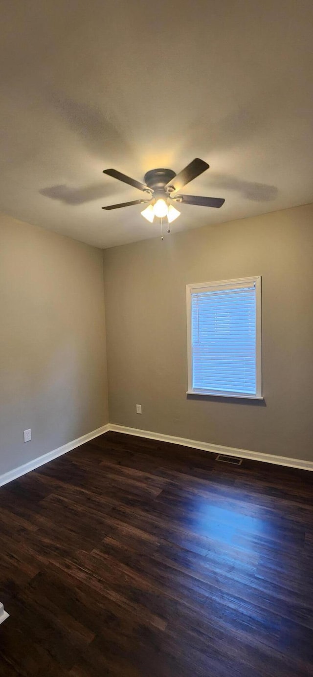 122 E 13th St, Covington, KY 41011 - spare room featuring ceiling fan and dark wood-style floors