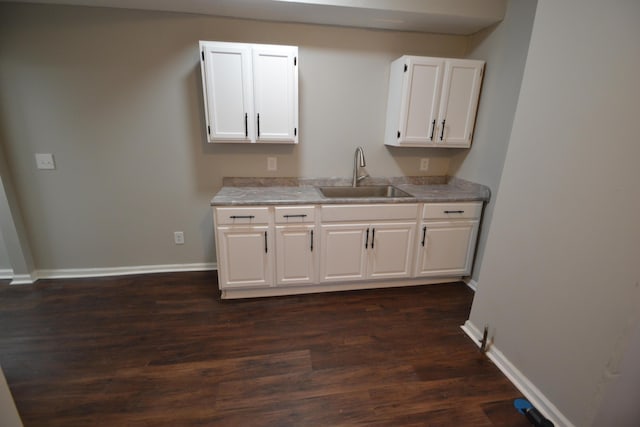 122 E 13th St, Covington, KY 41011 - kitchen with white cabinetry, dark wood-type flooring, and light countertops